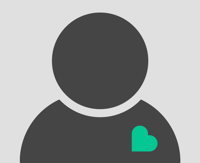 Vet doing a wellness exam on a little dog.